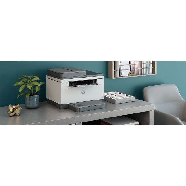 HP LaserJet MFP M232-M237 Light Basalt, Wireless Right facing on desk against teal wall, horizontal orientation